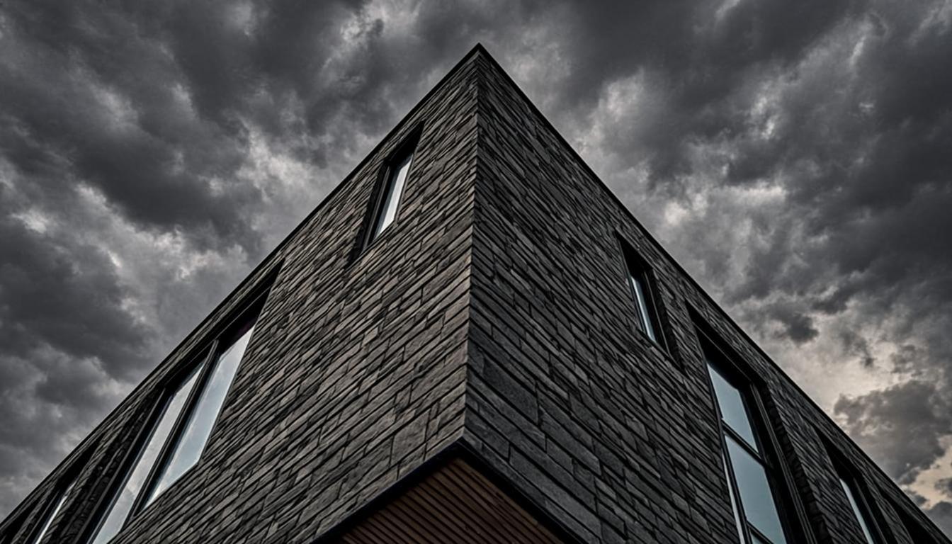 Architectural roof ridgeline against storm sky